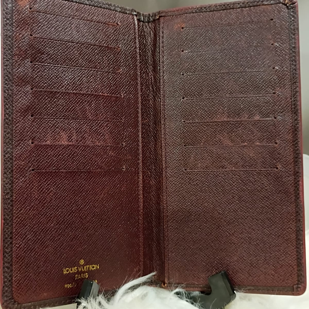 Louis Vuitton Taiga leather long wallet.